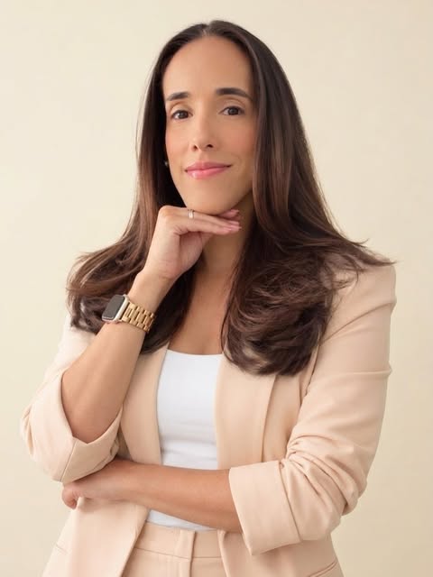 The founder of D’Magic Paper Art wearing a cream blazer